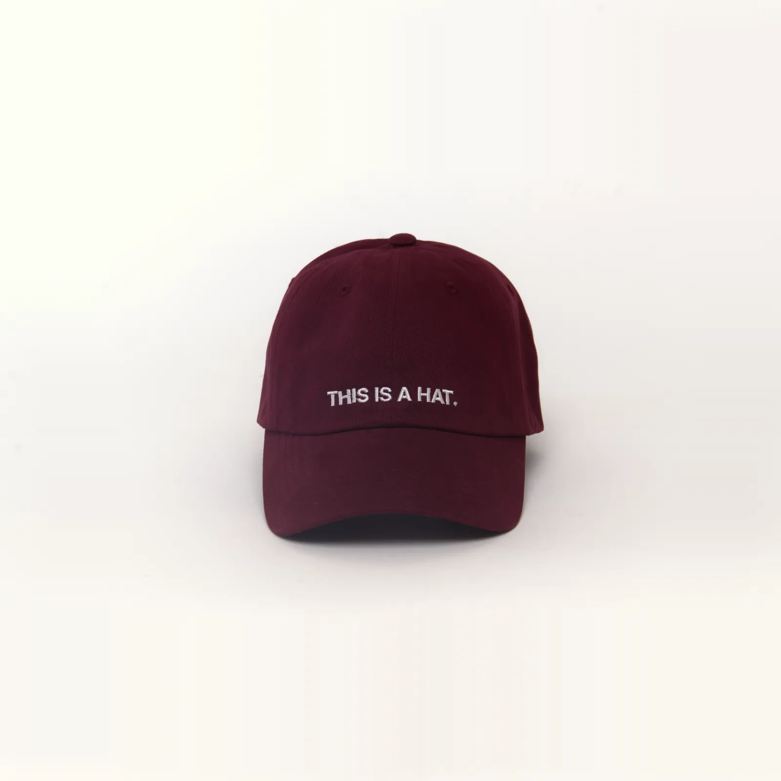 Maroon hat that says THIS IS A HAT, front view